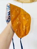 Blue Cacti + Orange Shapes Reversible Brimmed Bonnet, 18-24 months